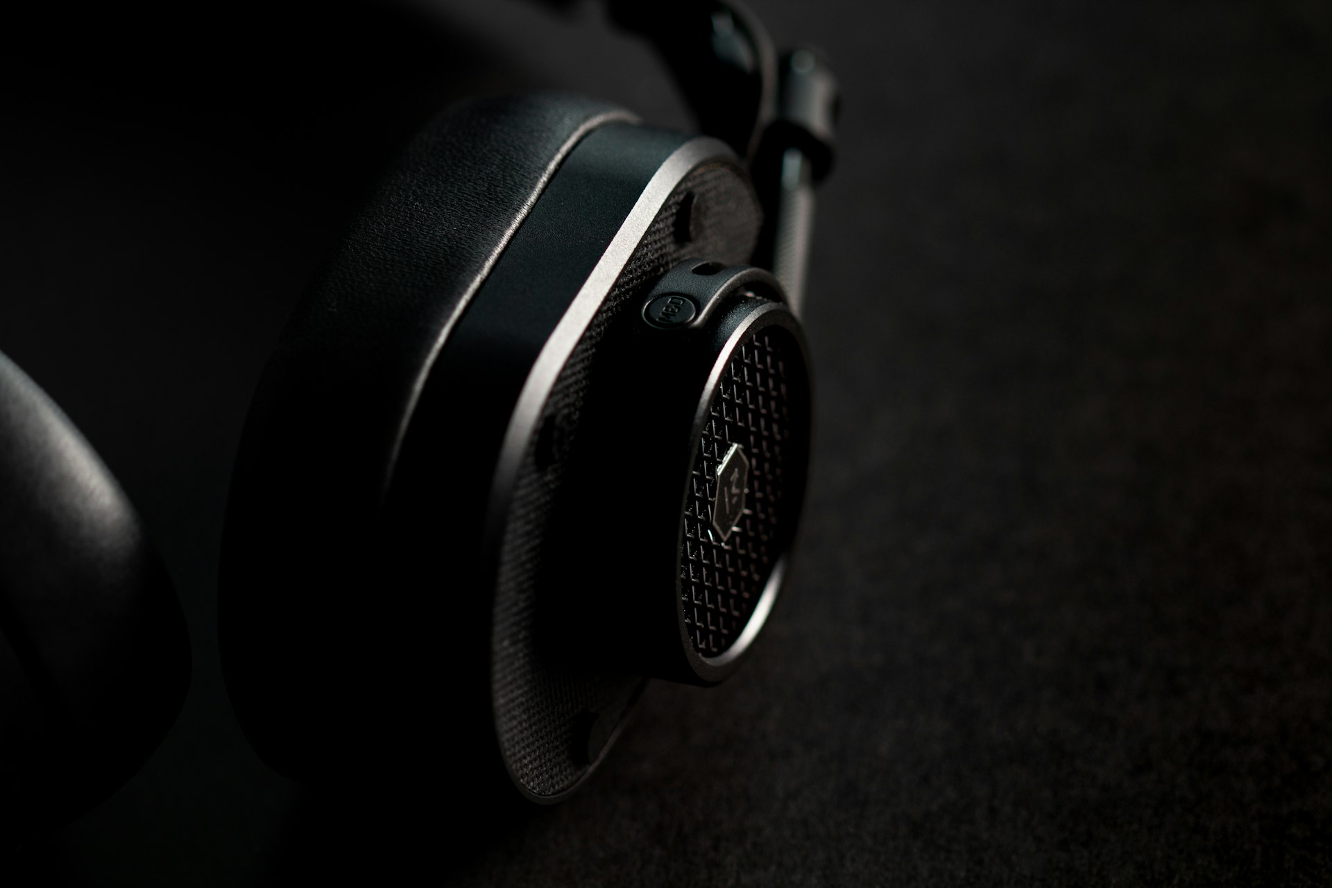 black and silver headphones on brown textile